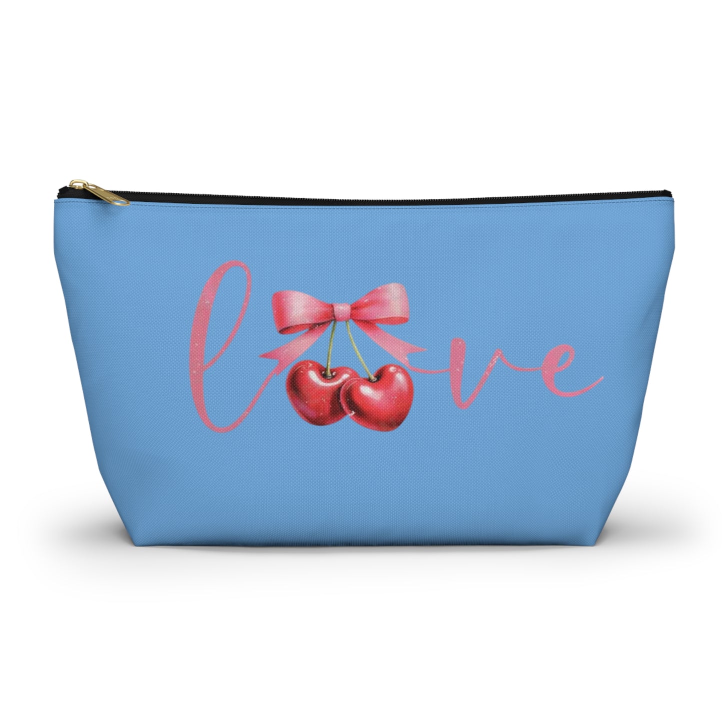 A small blue cosmetic case with a cherry design and the word 'love' printed on the front, featuring a gold-colored zipper closure.
