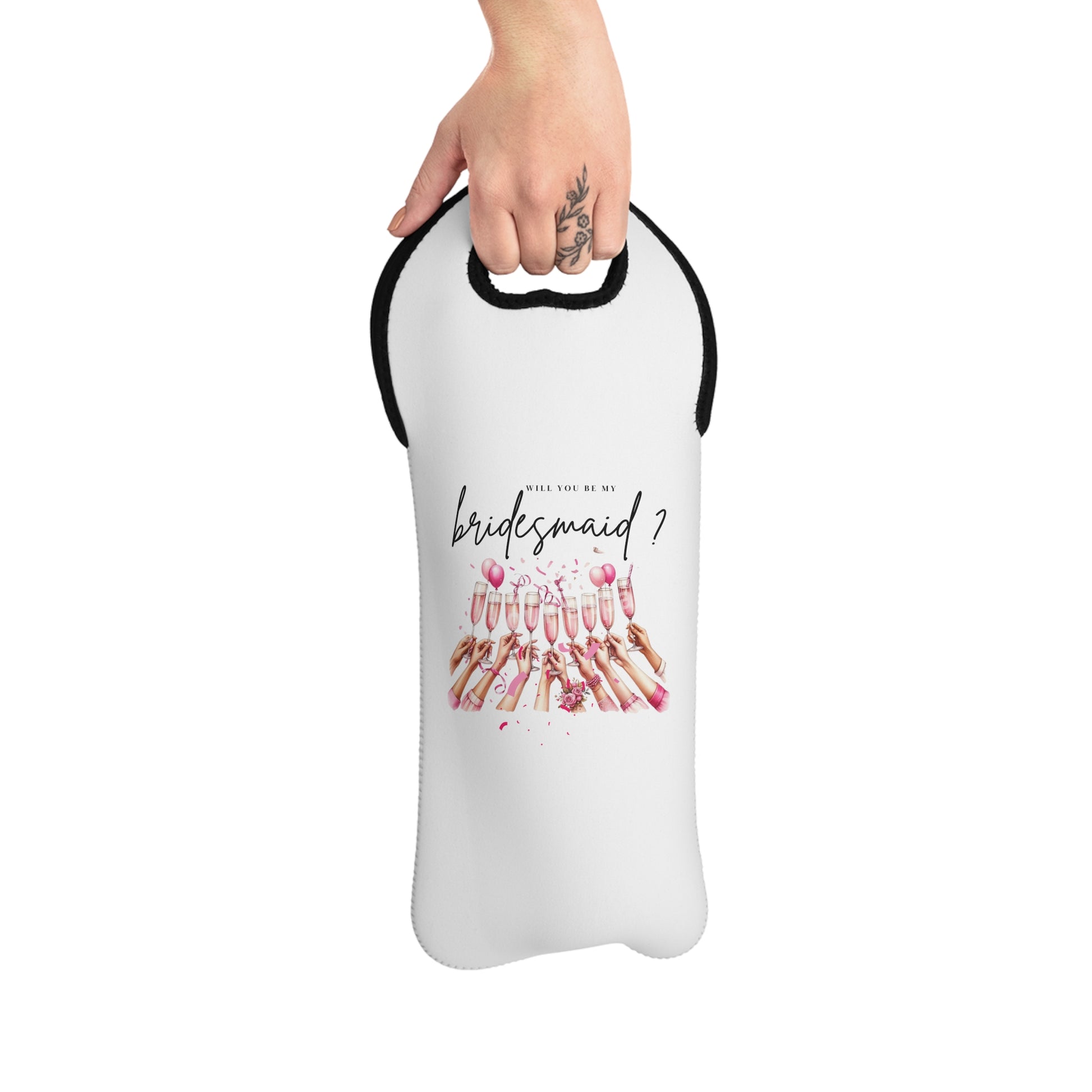 A hand holding a white neoprene wine tote bag with text and floral design, intended for carrying a wine bottle.