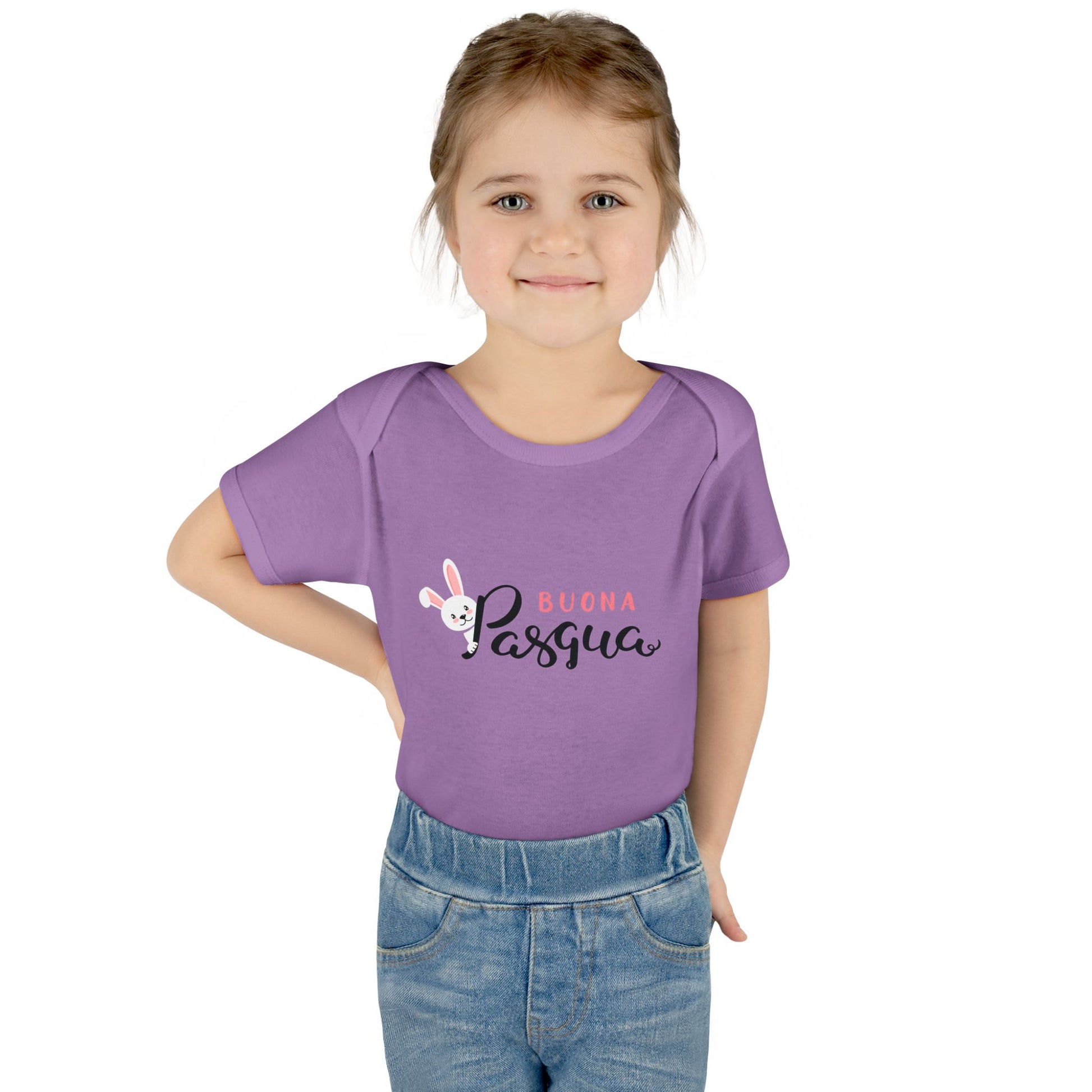 A toddler wearing a purple short-sleeved bodysuit with 'Buona Pasqua' and an Easter egg graphic printed on the front.