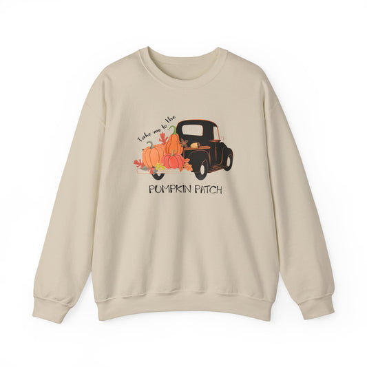 A beige sweatshirt with a graphic print of a pumpkin patch on the front.